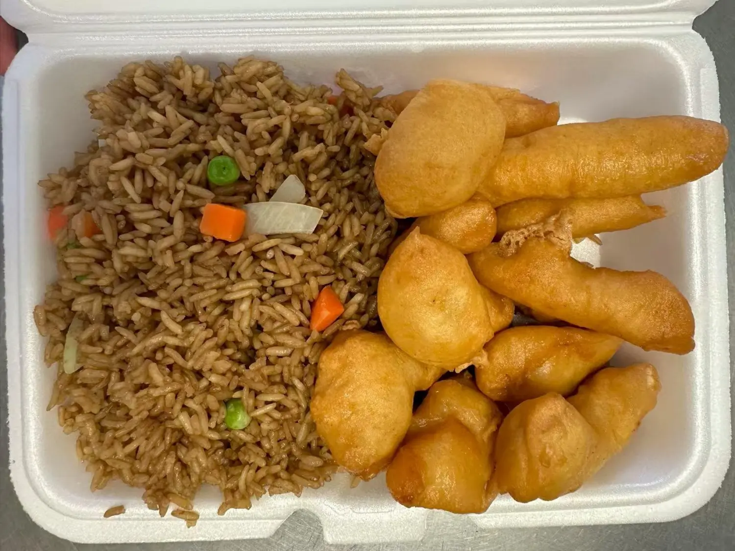 Crispy honey chicken paired with savory fried rice at Taste of China,a Chinese restaurant in Raleigh.